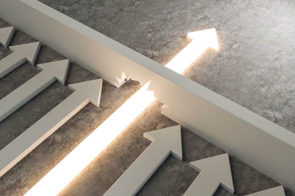 Shining arrow breaks through a wall while others remain blocked, suggesting disruption and success