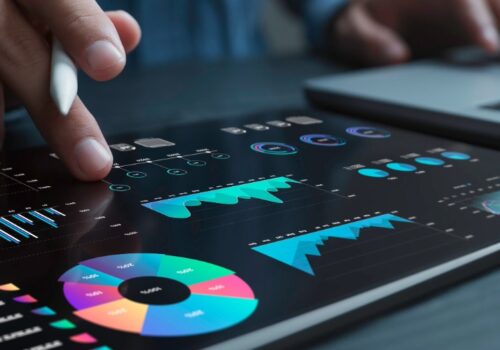 Banker using digital tools (tablet & PC) for financial analysis and investment activities